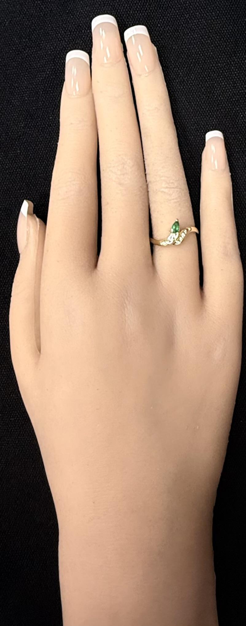 14K Yellow Gold Pear Cut Emerald With Channel Set Accent Diamond Bypass Ring