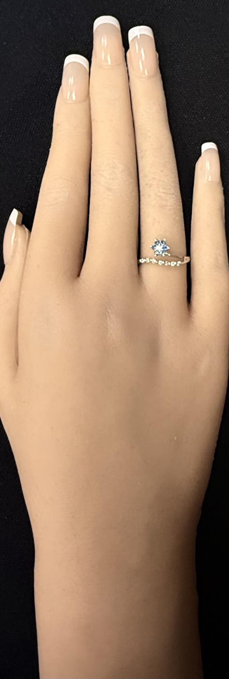 14K White Gold Blue Sapphire And .1ct Round Diamond Split Shank Flower Band Ring