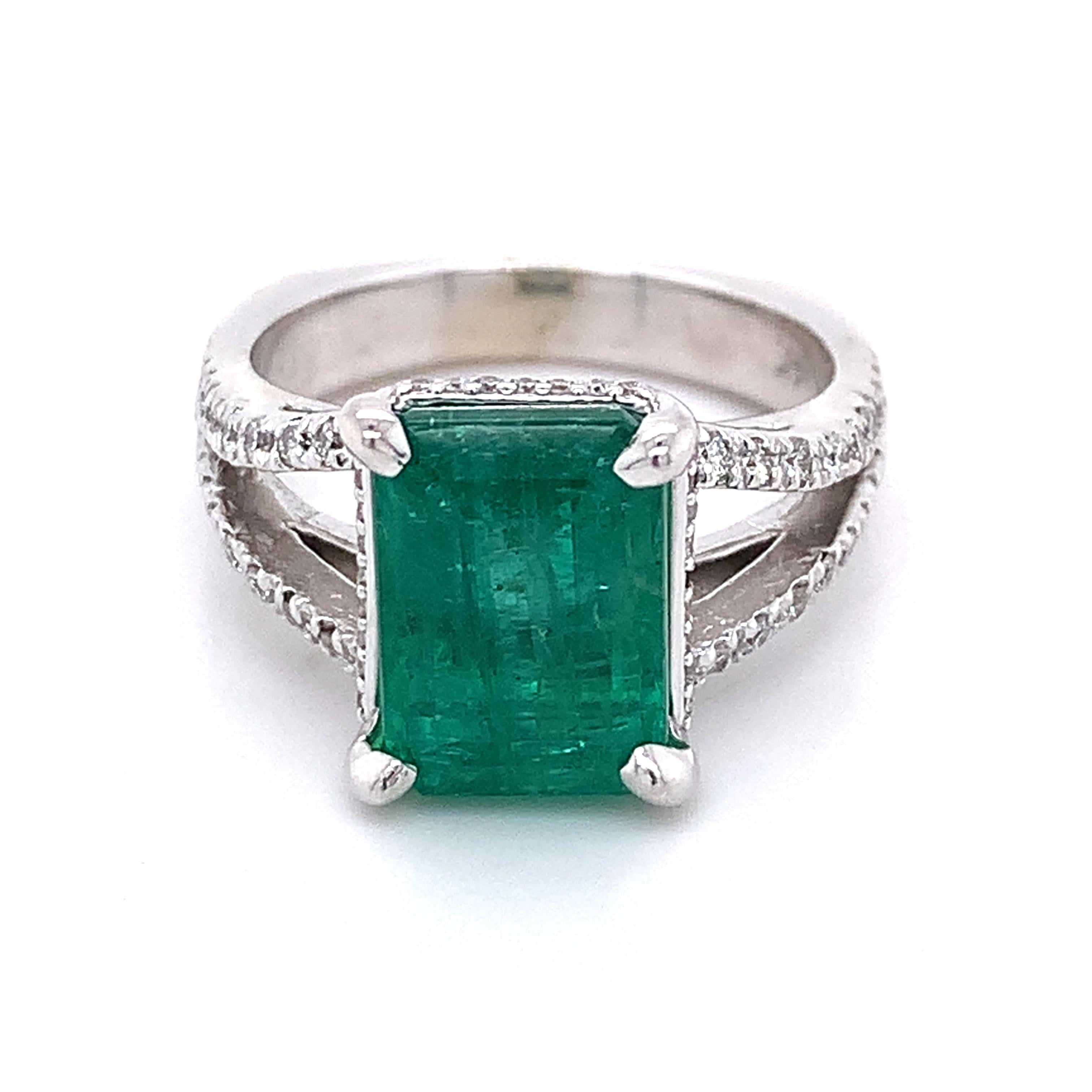 14K White Gold Emerald and Round Diamond Split Shank Open Cathedral Ring
