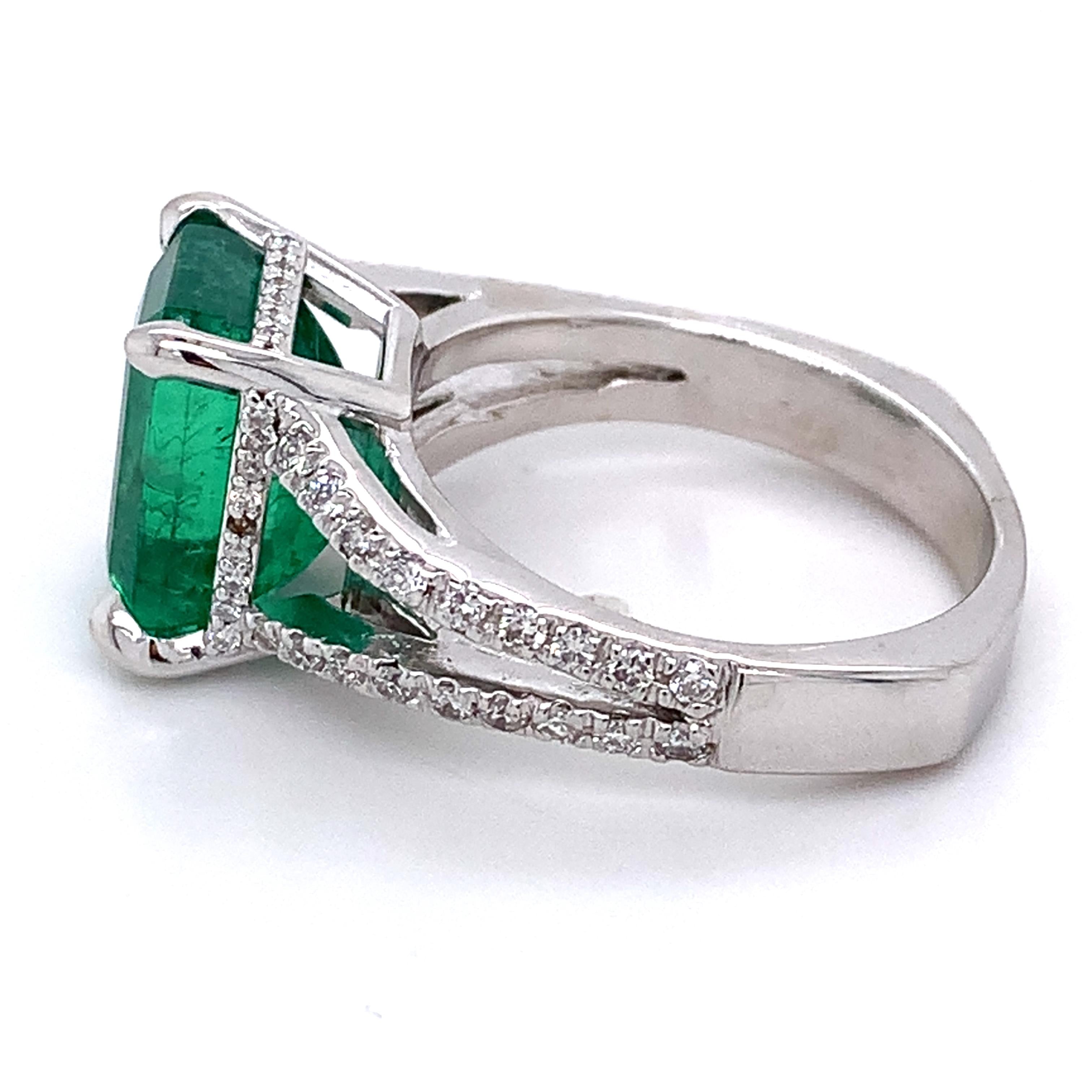 14K White Gold Emerald and Round Diamond Split Shank Open Cathedral Ring