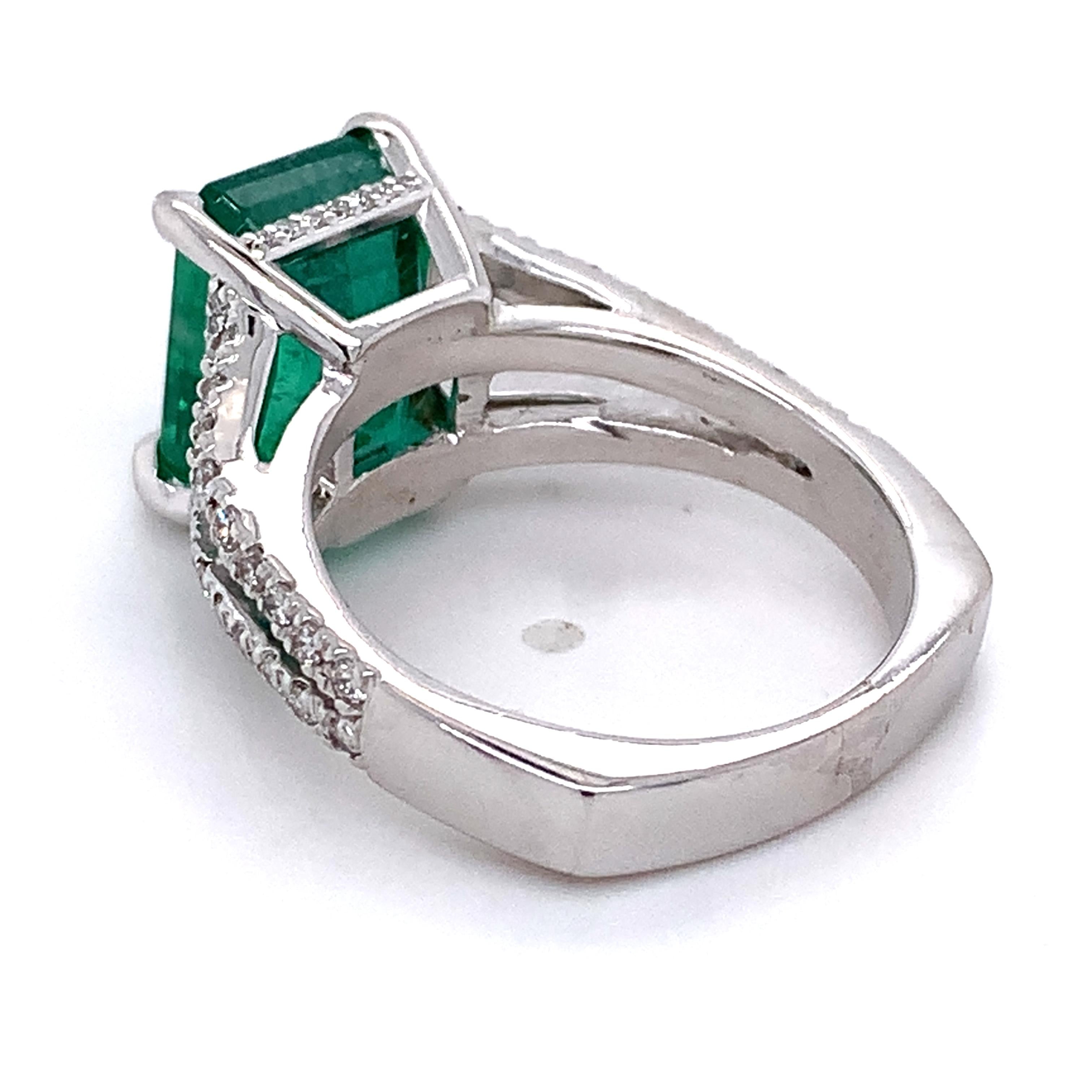 14K White Gold Emerald and Round Diamond Split Shank Open Cathedral Ring