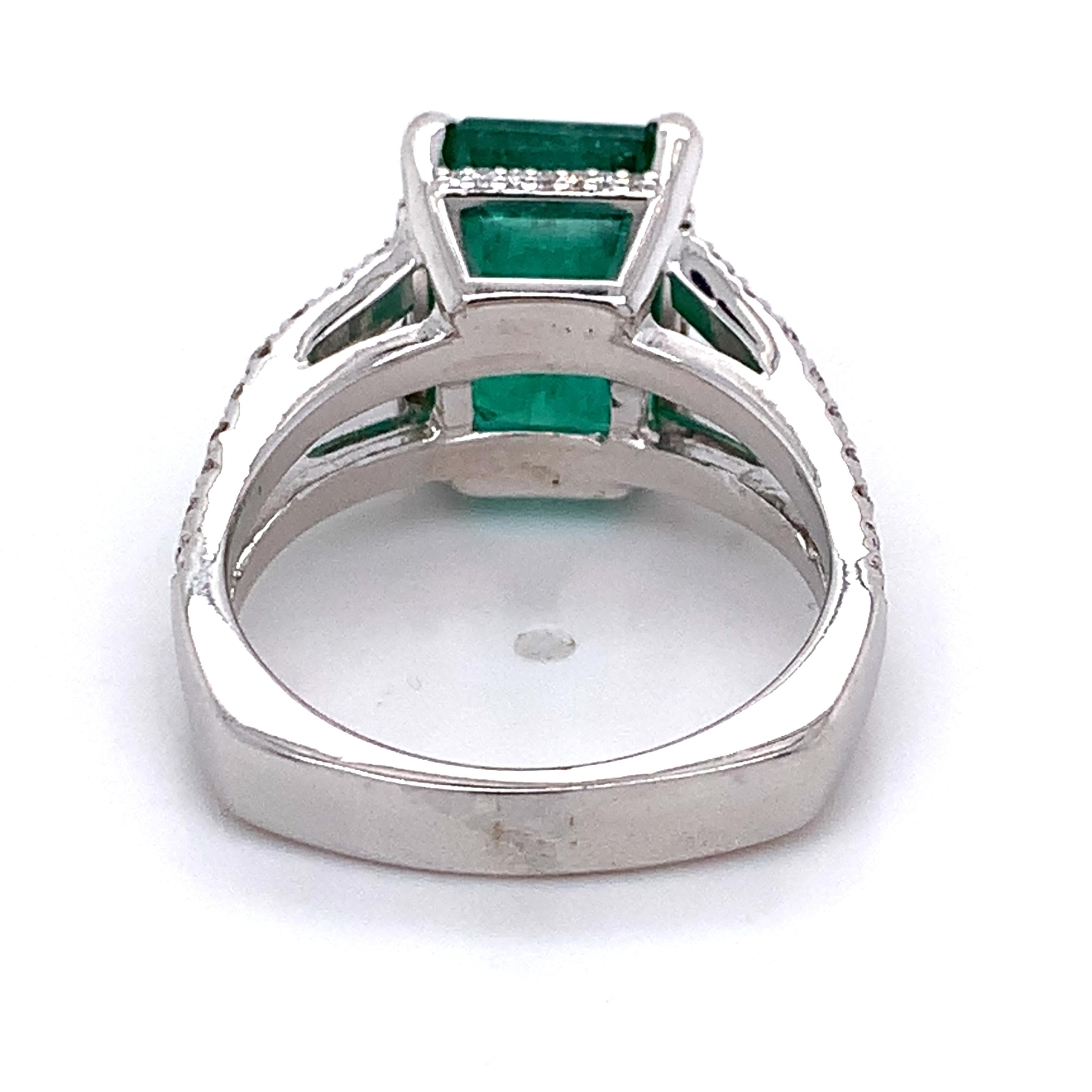 14K White Gold Emerald and Round Diamond Split Shank Open Cathedral Ring