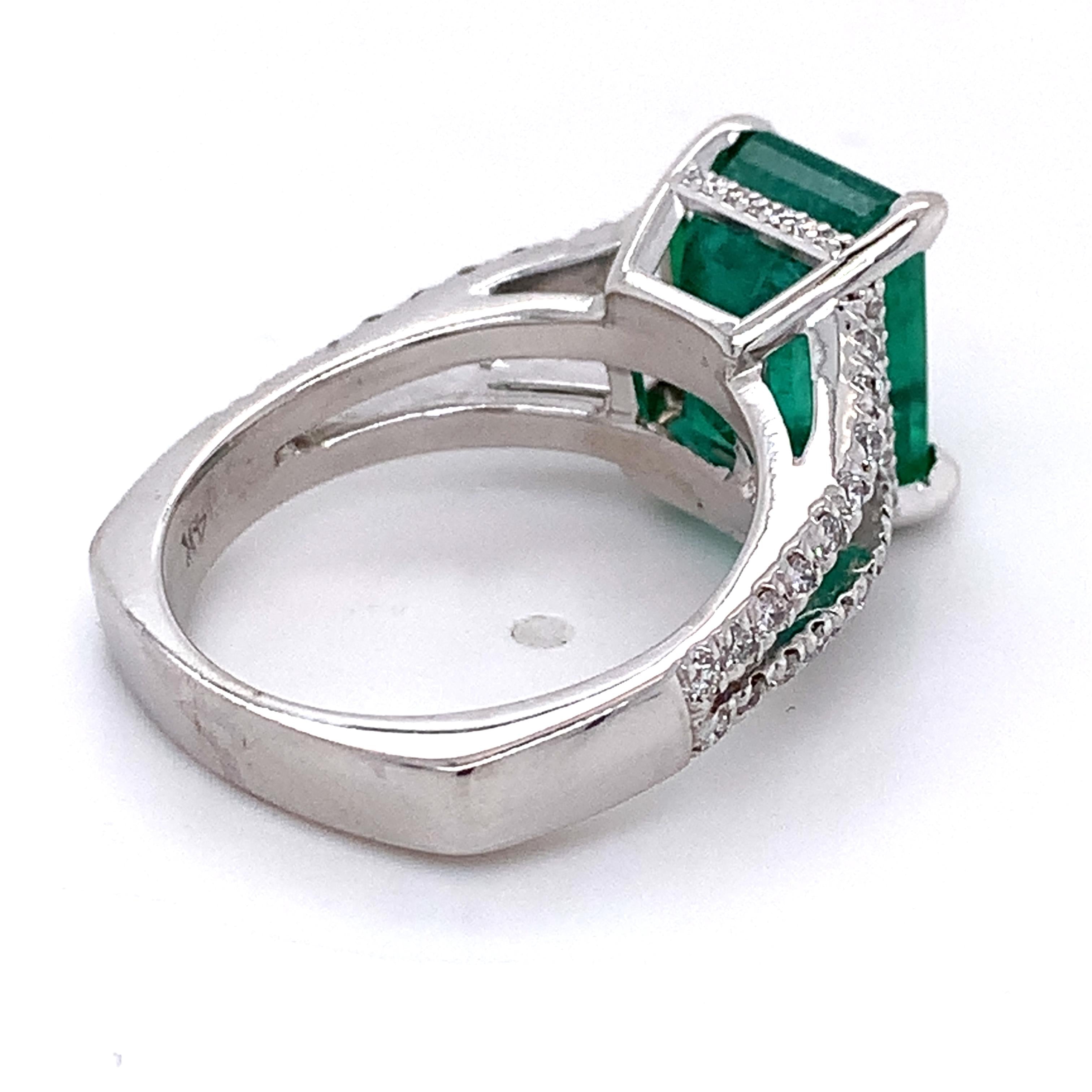 14K White Gold Emerald and Round Diamond Split Shank Open Cathedral Ring