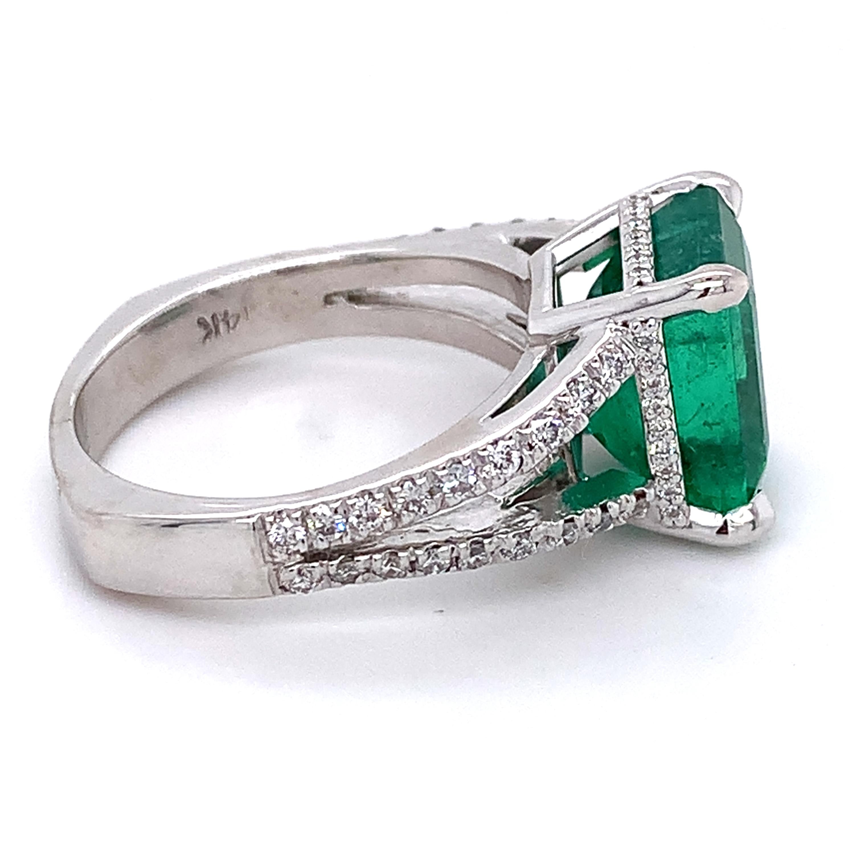 14K White Gold Emerald and Round Diamond Split Shank Open Cathedral Ring