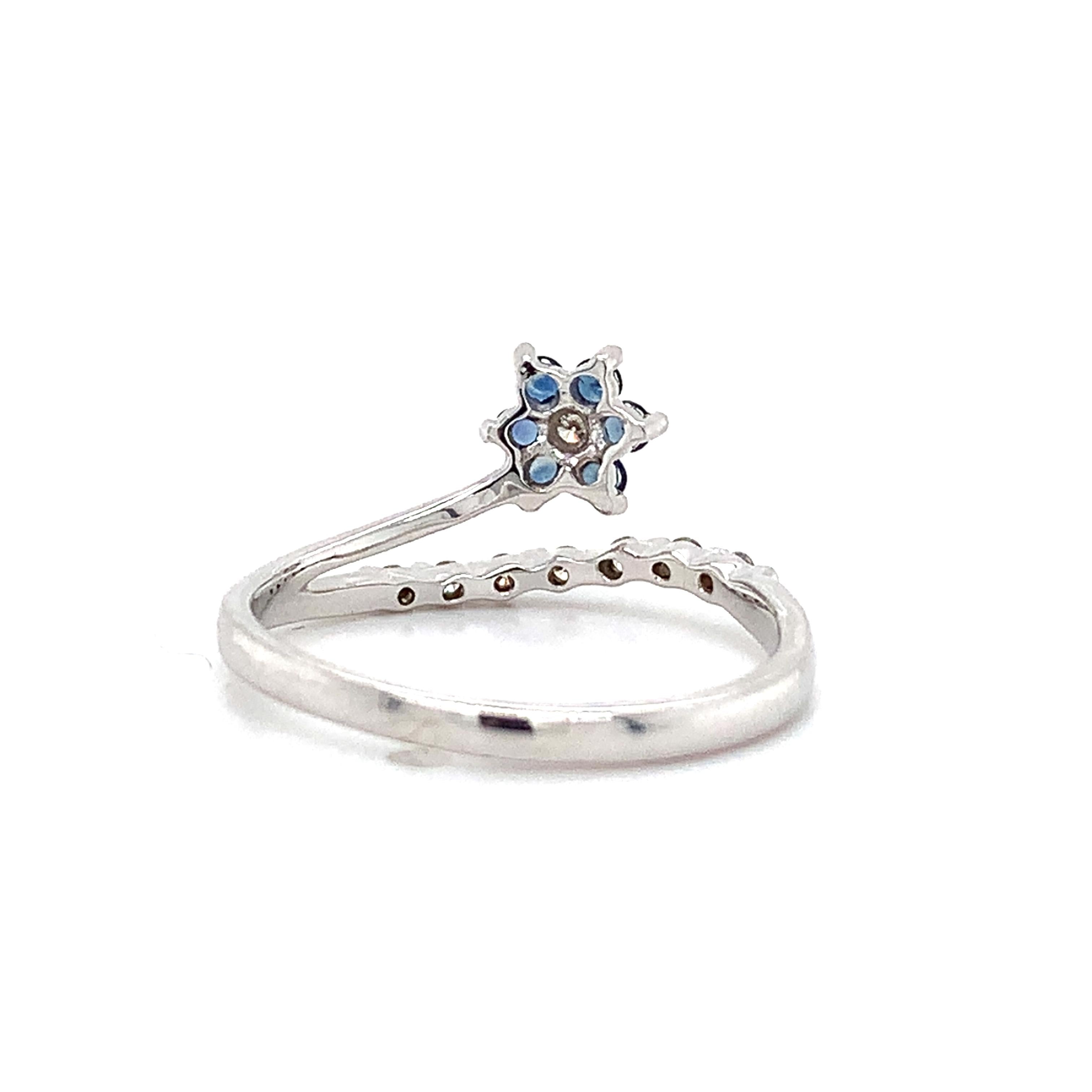 14K White Gold Blue Sapphire And .1ct Round Diamond Split Shank Flower Band Ring